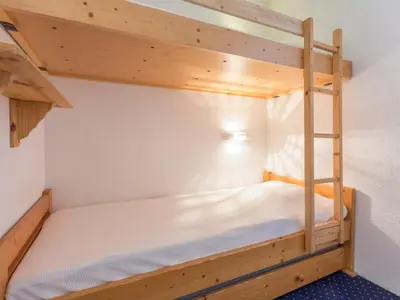 Un ou plusieurs lits dans un hébergement de l'établissement Studio Ski aux Pieds avec Balcon à Arcs 2000 - FR-1-346-467