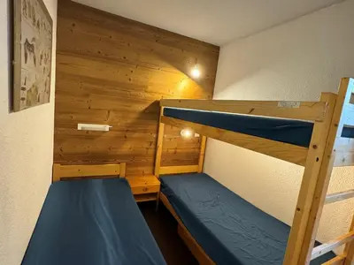 Un ou plusieurs lits dans un hébergement de l'établissement Appartement fonctionnel 5 pers · Skis aux pieds · Animaux admis - FR-1-181-2299