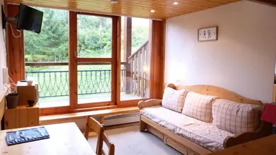 Coin salon dans l'établissement Résidence Aiguille Grive Bat Iii - Appartement 2 pièces 6 personnes en duplex, skis aux pieds, dans le village de Charmettoger à Arc 1800 MAE-1696
