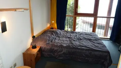 Un ou plusieurs lits dans un hébergement de l'établissement Résidence Aiguille Grive Bat Iii - Appartement 2 pièces 6 personnes en duplex, skis aux pieds, dans le village de Charmettoger à Arc 1800 MAE-2032