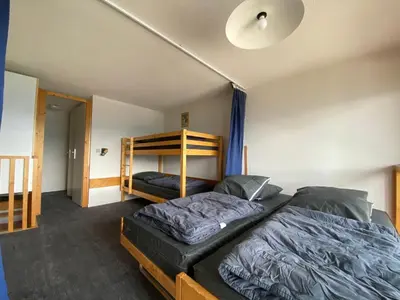 Un ou plusieurs lits dans un hébergement de l'établissement Duplex lumineux skis aux pieds avec balcon - FR-1-346-438