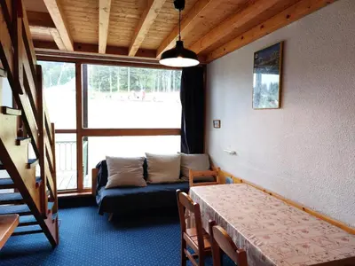 Coin salon dans l'établissement Résidence Tournavelles - Appartement 4 pièces 8/10 personnes en duplex, avec vue sur les pistes, skis aux pieds et proche des commerces dans le village d MAE-1865