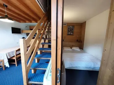 Un ou plusieurs lits dans un hébergement de l'établissement Résidence Tournavelles - Appartement 4 pièces 8/10 personnes en duplex, avec vue sur les pistes, skis aux pieds et proche des commerces dans le village d MAE-1865