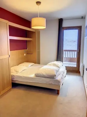 Un ou plusieurs lits dans un hébergement de l'établissement Appartement station Sainte Foy Tarentaise