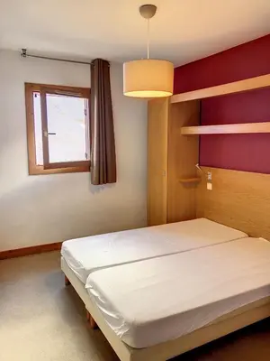 Un ou plusieurs lits dans un hébergement de l'établissement Appartement station Sainte Foy Tarentaise