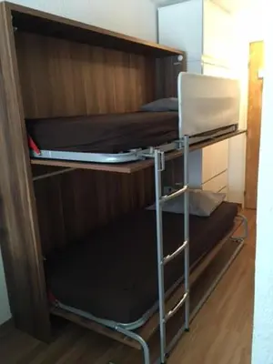 Un ou plusieurs lits superposés dans un hébergement de l'établissement studio cabine chalet club III entièrement rénové