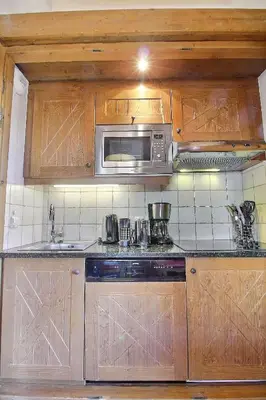 Cuisine ou kitchenette dans l'établissement ARC 1950 - Suite de Prestige - Cheminée intérieur