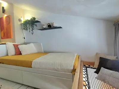 Un ou plusieurs lits dans un hébergement de l'établissement Duplex Mezzanine 5 pers. · Ski aux pieds · Vue Mont Blanc - FR-1-346-426