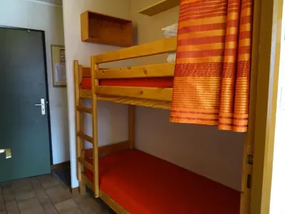 Un ou plusieurs lits superposés dans un hébergement de l'établissement Résidence Plein Sud - Plan Peisey - Studio 4 personnes à Plan Peisey proche des commerces et des pistes MAE-1964