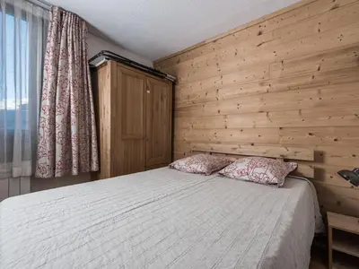 Un ou plusieurs lits dans un hébergement de l'établissement Appartement rénové proche pistes - Balcon et animaux acceptés - FR-1-502-372