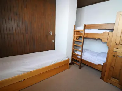 Un ou plusieurs lits dans un hébergement de l'établissement Appartement fonctionnel Proches des pistes et des commerces Balcon - FR-1-502-390
