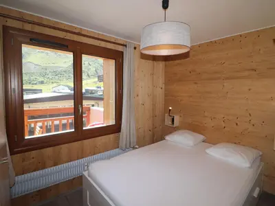 Un ou plusieurs lits dans un hébergement de l'établissement Appartement rénové pour 4 pers. avec balcon et WIFI, proche pistes - FR-1-502-406