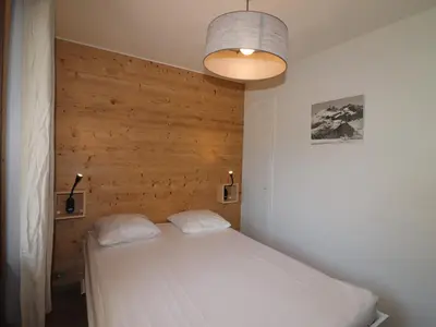 Un ou plusieurs lits dans un hébergement de l'établissement Appartement rénové pour 4 pers. avec balcon et WIFI, proche pistes - FR-1-502-406