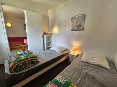 Un ou plusieurs lits dans un hébergement de l'établissement Studio 4 pers. pieds des pistes avec balcon à Tignes - FR-1-502-409