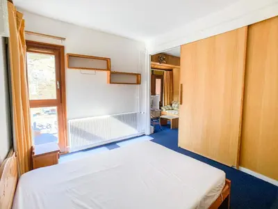 Un ou plusieurs lits dans un hébergement de l'établissement Appartement lumineux au pied des pistes, animaux admis - FR-1-502-437
