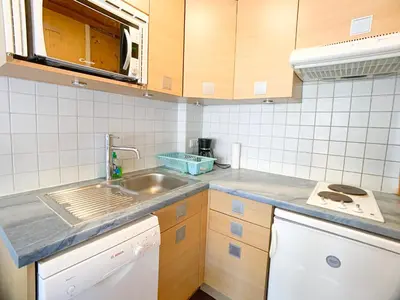 Cuisine ou kitchenette dans l'établissement Appartement lumineux au pied des pistes, animaux admis - FR-1-502-437