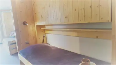 Un ou plusieurs lits dans un hébergement de l'établissement Résidence Le Palafour - Joli et grand studio 4 personnes à Tignes au pied des pistes, des commerces, de l'ESF et de l'office du tourisme dans le quarti MAE-2103