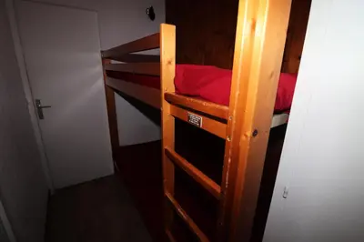 Un ou plusieurs lits superposés dans un hébergement de l'établissement Résidence Home Club - Studio avec vue sur le lac du Chevril MAE-7504