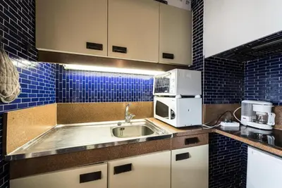 Cuisine ou kitchenette dans l'établissement Résidence Bec Rouge - Appartement lumineux·Accès direct pistes·Balcon MAE-7594