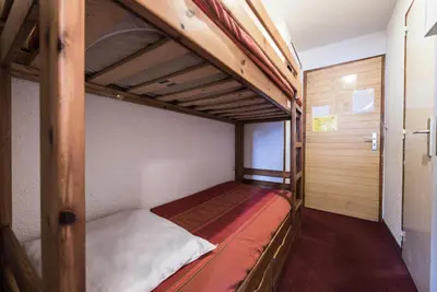 Un ou plusieurs lits dans un hébergement de l'établissement Chalet Club Iv - Blanchot - Studio·Proches des pistes et commerces·Balcon MAE-7804