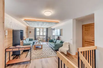 Coin salon dans l'établissement Résidence Les Rives - Appartement rénové - 82m2 - 8 personnes MAE-7304