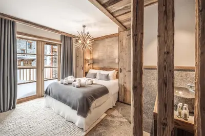 Un ou plusieurs lits dans un hébergement de l'établissement Madame Vacances Chalet Les Sources de l'Isère