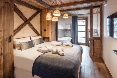 Un ou plusieurs lits dans un hébergement de l'établissement Madame Vacances Chalet Les Sources de l'Isère