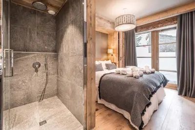 Un ou plusieurs lits dans un hébergement de l'établissement Madame Vacances Chalet Les Sources de l'Isère