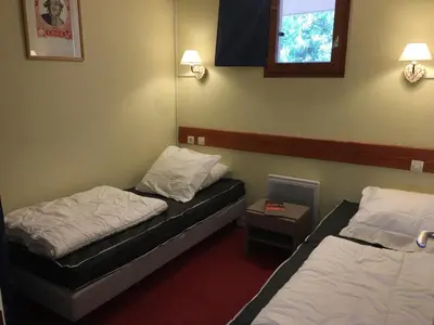 Un ou plusieurs lits dans un hébergement de l'établissement Agréable appartement au calme avec balcon et Wifi gratuit - FR-1-346-520