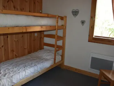 Un ou plusieurs lits dans un hébergement de l'établissement Appartement spacieux 8 pers - Proche télécabine - FR-1-464-207