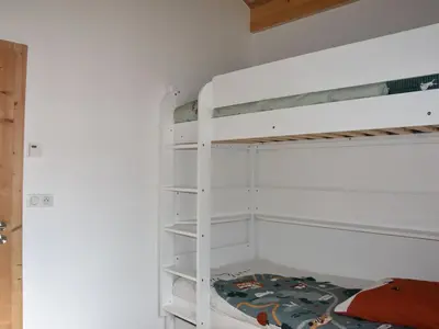 Un ou plusieurs lits dans un hébergement de l'établissement Appartement Neuf avec Balcon à 400m des Remontées Mécaniques - Capacité 5 Personnes - FR-1-464-209