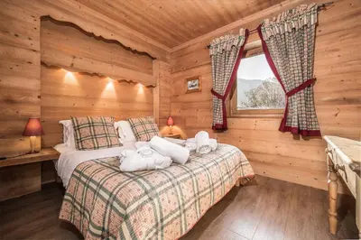 Un ou plusieurs lits dans un hébergement de l'établissement Madame Vacances Chalet La Grande Sassière