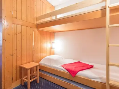 Un ou plusieurs lits dans un hébergement de l'établissement Studio au pied des pistes avec balcon - FR-1-346-439