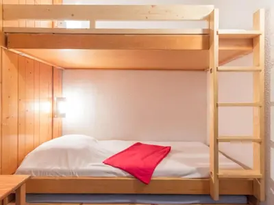 Un ou plusieurs lits dans un hébergement de l'établissement Studio au pied des pistes avec balcon - FR-1-346-439