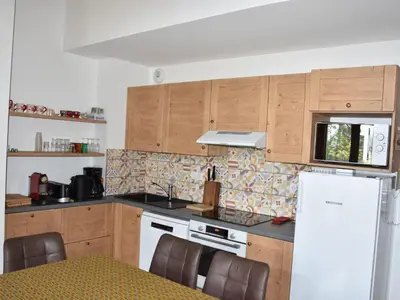 Cuisine ou kitchenette dans l'établissement Duplex 4 pièces, 2 étoiles, proche du centre, max 6 pers. - FR-1-464-210