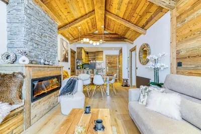 Coin salon dans l'établissement Appartement style chalet 5* vue Mont-Blanc - Arc 1950