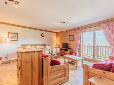 Coin salon dans l'établissement Appartement spacieux 8 pers with Parking & WIFI, proche des pistes - FR-1-352-79
