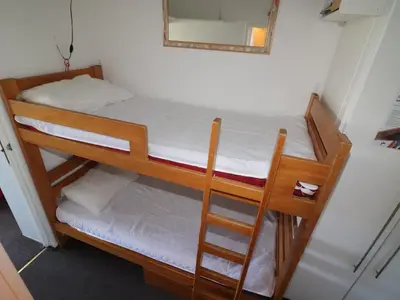 Un ou plusieurs lits dans un hébergement de l'établissement Studio confortable avec balcon, animaux acceptés, proche pistes - FR-1-502-465