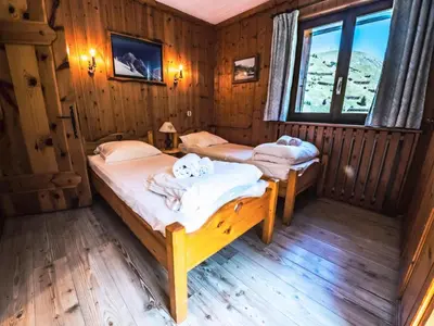 Un ou plusieurs lits dans un hébergement de l'établissement Chalet Neve - GRAND APPARTEMENT AVEC VUE SUR LA GRANDE MOTTE MAE-2344