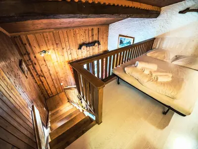Un ou plusieurs lits dans un hébergement de l'établissement Chalet Neve - BEAU DUPLEX SOUS LES TOITS AVEC CHEMINEE MAE-2354