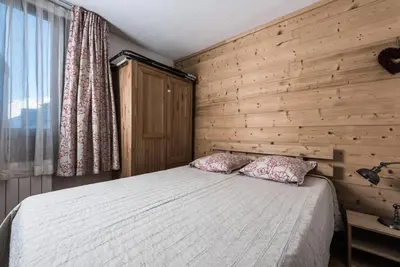 Un ou plusieurs lits dans un hébergement de l'établissement Résidence Grandes Platieres 2 - Appartement chaleureux et authentique MAE-2534