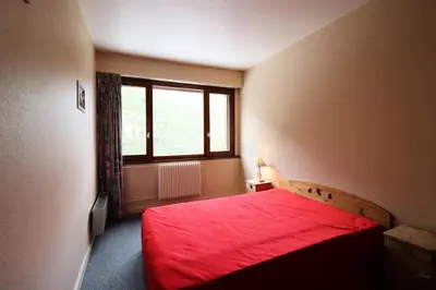 Un ou plusieurs lits dans un hébergement de l'établissement Résidence Bec Rouge - Appartement spacieux·Skis aux pieds·Balcon MAE-2674