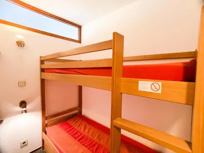 Un ou plusieurs lits dans un hébergement de l'établissement Résidence Hameau Du Borsat 3 - Appartement lumineux · Accès direct aux pistes MAE-2684