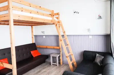 Coin salon dans l'établissement Résidence Bec Rouge - Appartement lumineux·Accès direct aux pistes·Balco MAE-2824