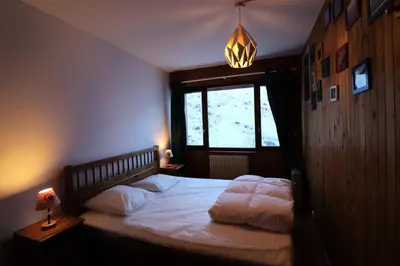 Un ou plusieurs lits dans un hébergement de l'établissement Résidence Bec Rouge - Appartement spacieux·Skis aux pieds·Balcon MAE-2844