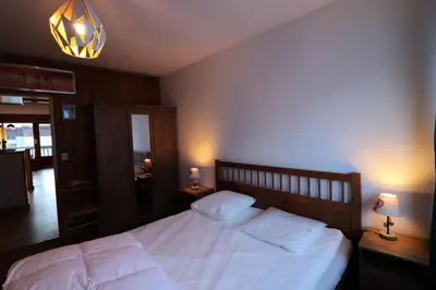 Un ou plusieurs lits dans un hébergement de l'établissement Résidence Bec Rouge - Appartement spacieux·Skis aux pieds·Balcon MAE-2844