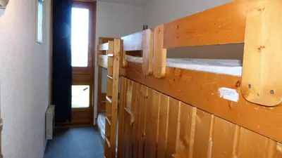 Un ou plusieurs lits superposés dans un hébergement de l'établissement Résidence Bequi-rouge - Appartement 2 pièces 5 personnes, proche des pistes, au cœur de la station d’Arc 1800 dans le village des Villards MAE-1764