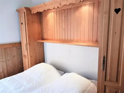 Un ou plusieurs lits dans un hébergement de l'établissement Résidence Le Chamois - Très bel appartement de style montagne, spacieux situé à proximité des pistes MAE-3544
