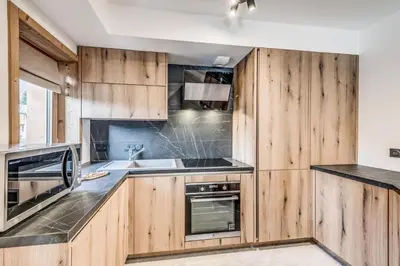 Cuisine ou kitchenette dans l'établissement Résidence Le Grand Bouquetin - 3 Pièces pour 6 Personnes MAE-9984