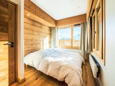 Un ou plusieurs lits dans un hébergement de l'établissement Appartement rénové 2 pièces cabine proche pistes avec WIFI - FR-1-502-463